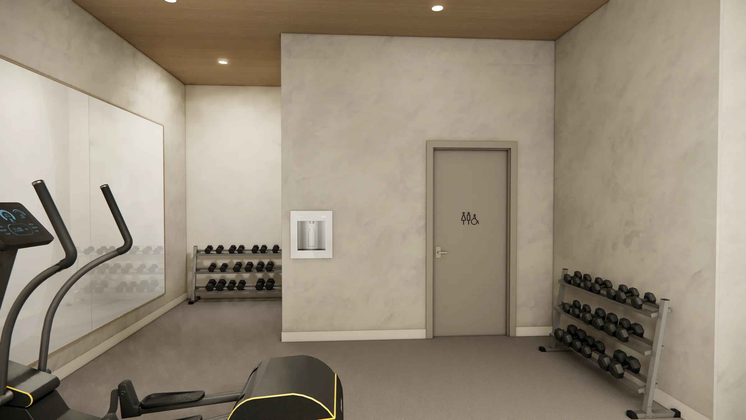 Dumbbell racks, bottle-filling station, and washroom entry at the Serenity Kelowna gym